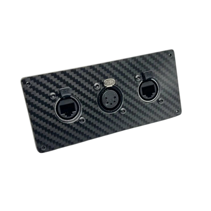 A rectangular black carbon fiber panel with three circular audio or control connectors, shown on a plain white background.